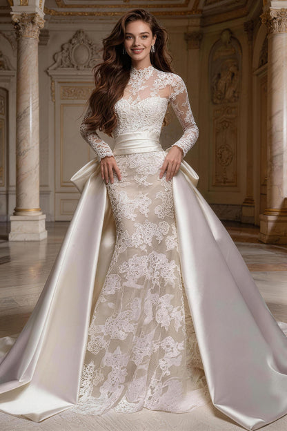 Fitted, ruched wedding gown featuring white tulle, satin, and a voluminous skirt.