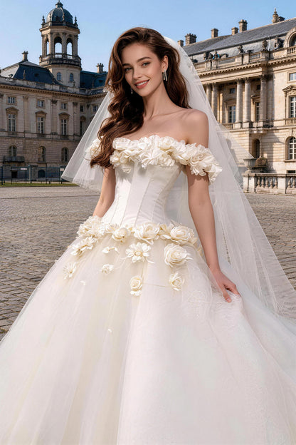 White fitted tulle wedding gown featuring ruching, floral details, and a voluminous skirt.