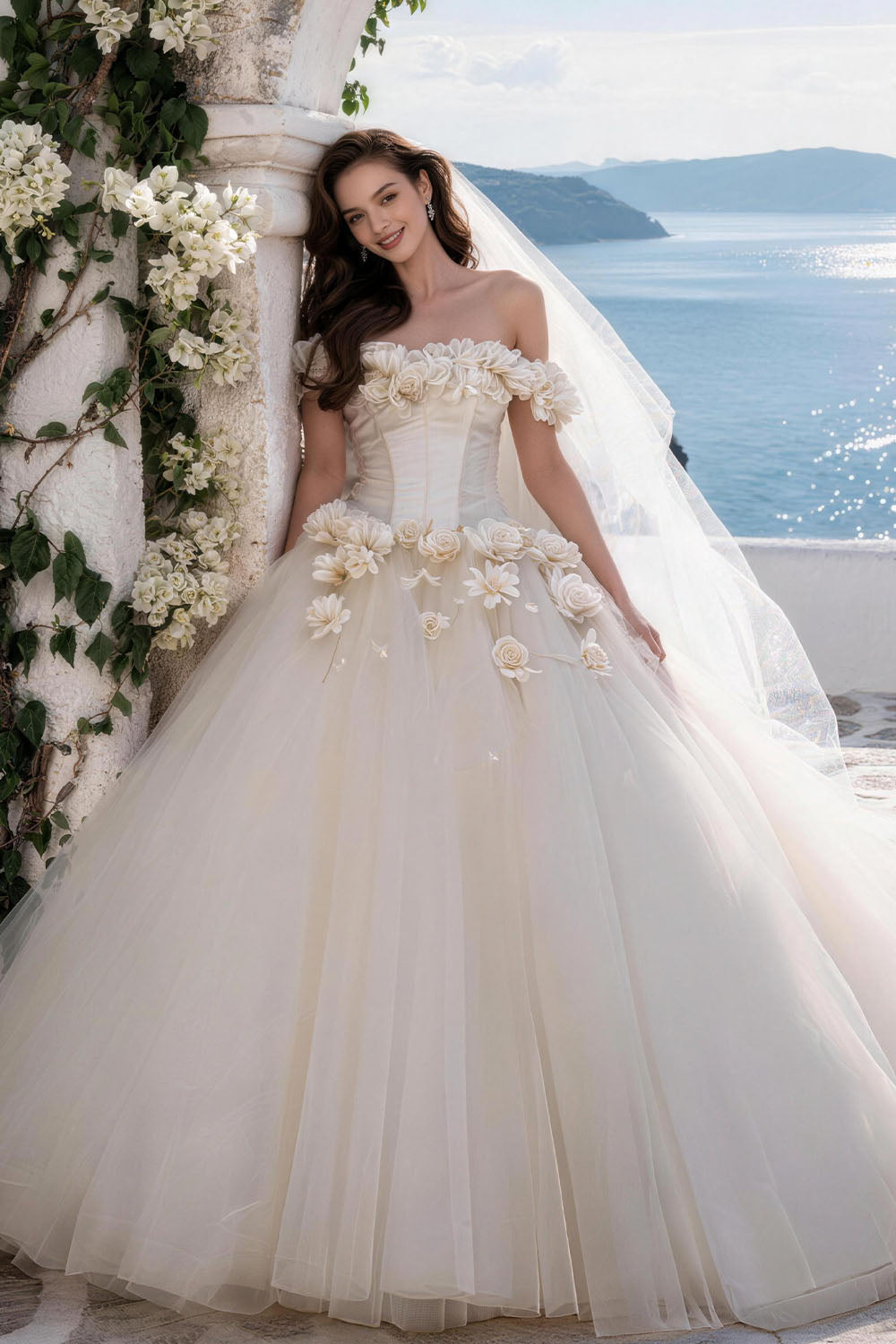 White fitted tulle wedding gown featuring ruching, floral details, and a voluminous skirt.