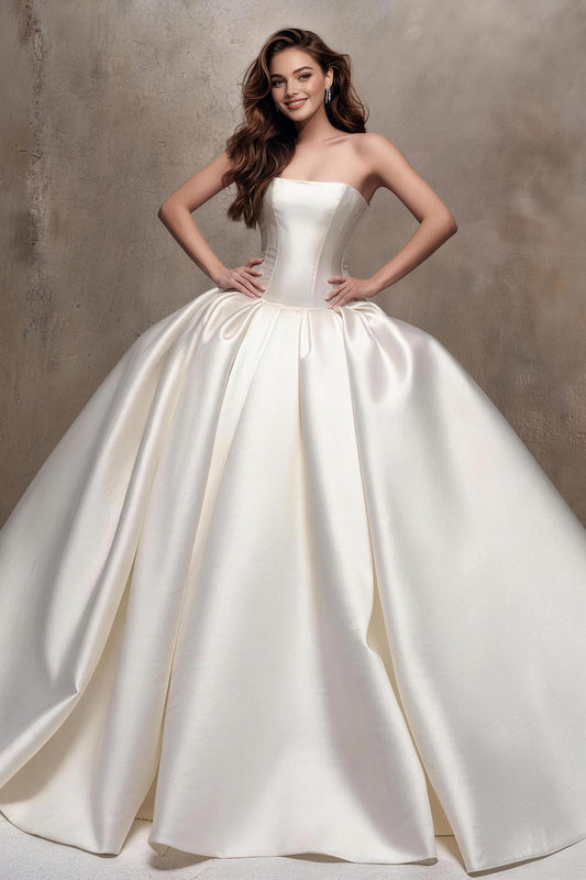 Fitted white satin wedding gown with ruching and a voluminous skirt.