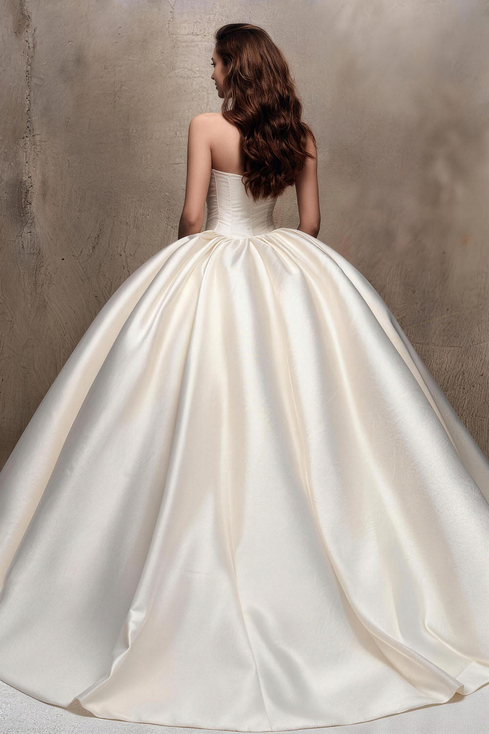 Fitted white satin wedding gown with ruching and a voluminous skirt.