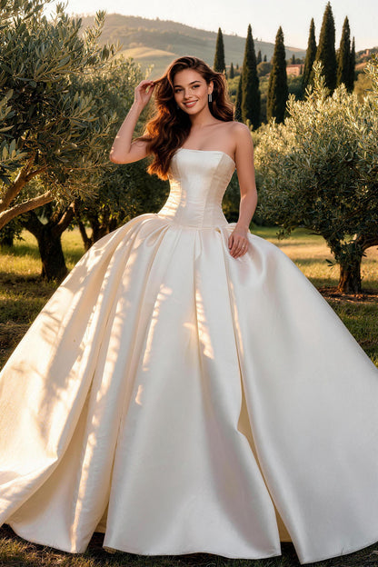 Fitted white satin wedding gown with ruching and a voluminous skirt.