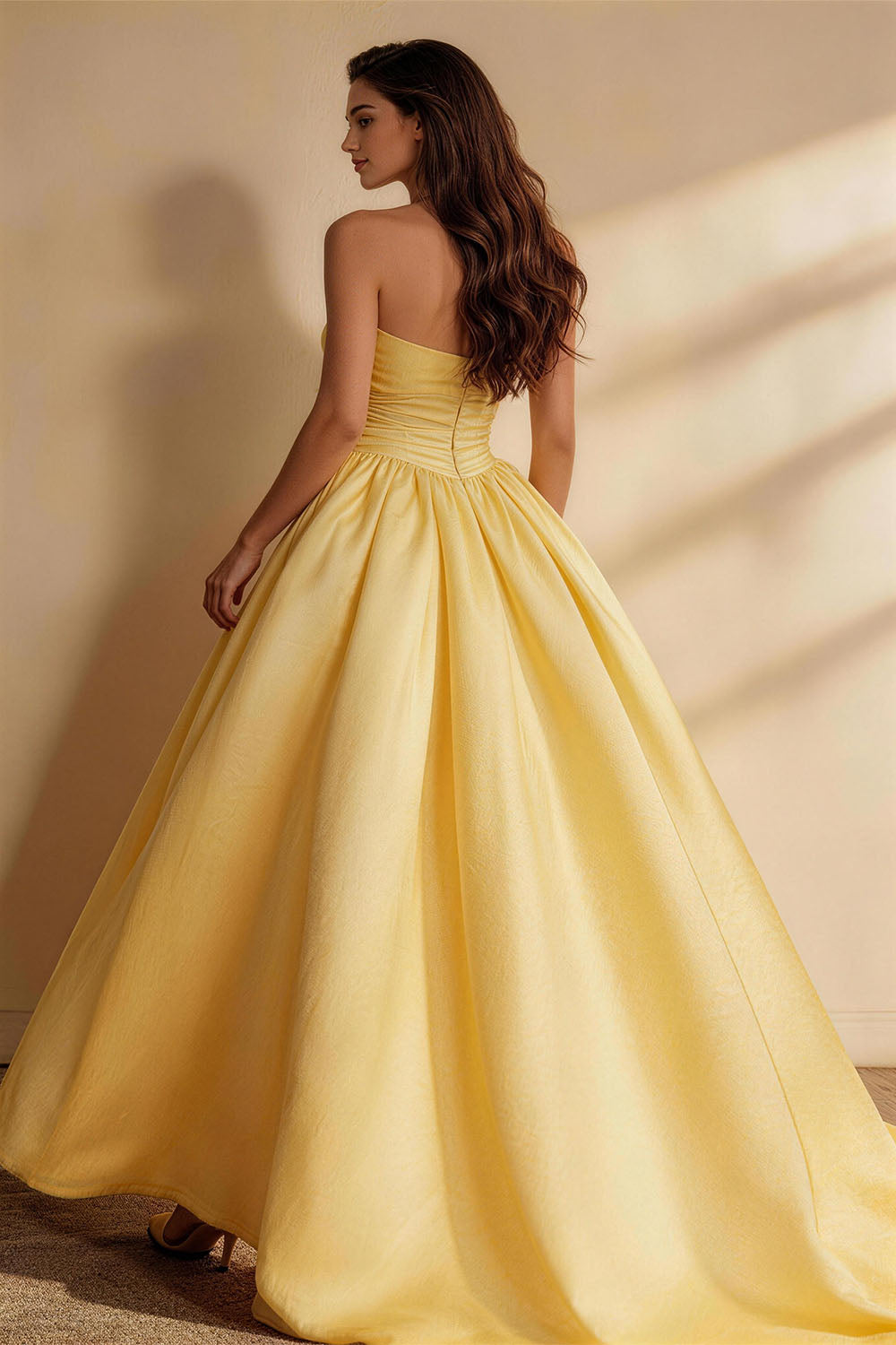 Yellow lightweight linen fitted, ruched, strapless gown