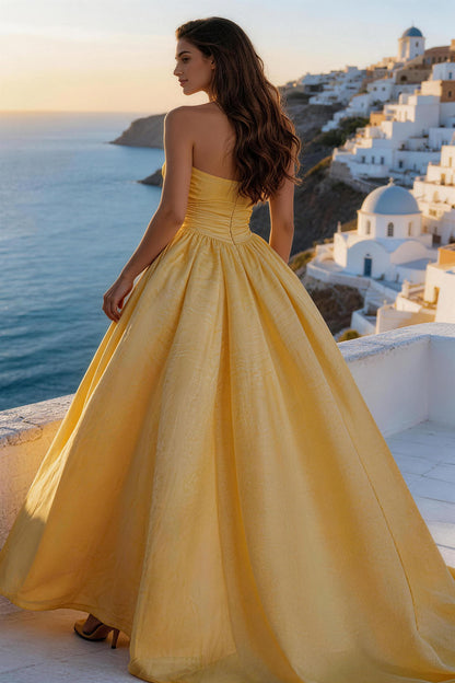 Yellow lightweight linen fitted, ruched, strapless gown
